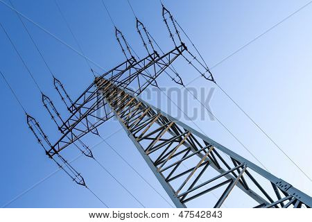 electrical tower with blue sky in early evening