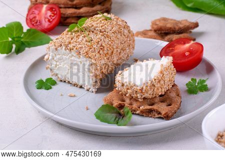 Caboc, Scottish Soft Cheese Made Of Fat Milk, In Oat Grains Served On The Plate