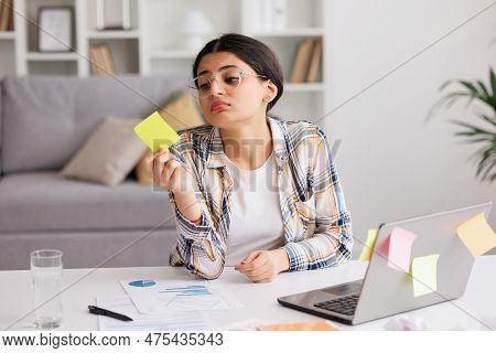 A Tired Young Indian Girl Gets Angry From The Number Of Tasks, Crumples Up The Paper And Throws It A