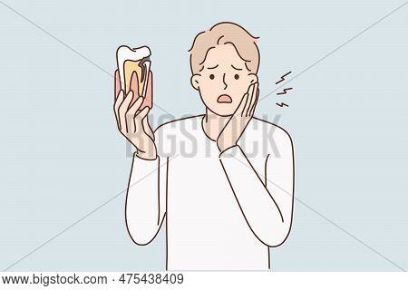 Man Suffering From Toothache In Desperation Puts Palm On Cheek Shows Injured Tooth In Need Of Dentis