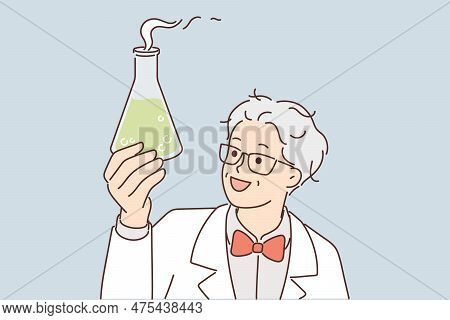 Laboratory Assistant In White Coat Holds Flask With Green Fuming Liquid While Examining Chemical Rea