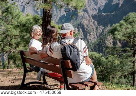 Group Of Senior Friends Enjoying Trekking Day On Mountain - Elderly Caucasian Man And Women Sitting 