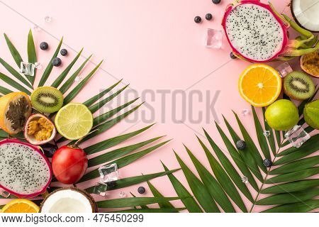 Refreshing Summer Treats. A Top View Flat Lay Of Exotic Fruits Like Dragon Fruit, Kiwi, Orange, Lime