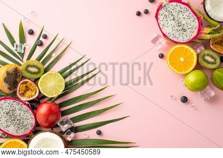Tropical Getaway. A Stunning Top View Flat Lay Of Exotic Fruits Like Dragon Fruit, Kiwi, Orange, Lim