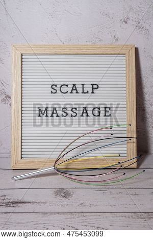 Scalp Massager For Home With Letter Board Scalp Massage Text. Close Up Of Scalp Massaging Brush For 