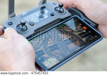 November 5, 2018 In Bangkok, The Hands Of A Man. Use A Remote Control That Connects To The Smartphon