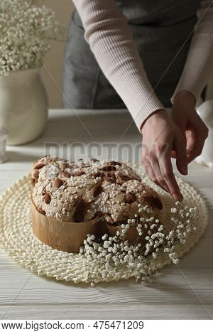 Woman Decorating Delicious Italian Easter Dove Cake (traditional Colomba Di Pasqua) With Flowers At 