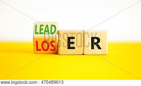Loser Or Leader Symbol. Businessman Turns Wooden Cubes And Changes The Word Loser To Leader. Beautif