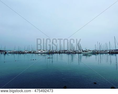 Sailboat Reflections At Port Sidney Marina On A Dreary Dark And Overcast Day - Sidney, Vancouver Isl