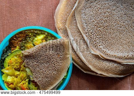Flat Lay View Of Injera With Lentils And Vegetables, Injera Is A Sour Fermented Flatbread Popular In