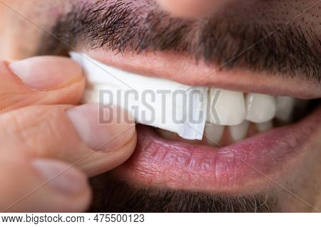 Man Chewing Wet Moist Nicotine Tobacco Snus Product
