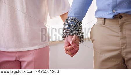 Codependent Relationship Couple. Hand Tied By Chain