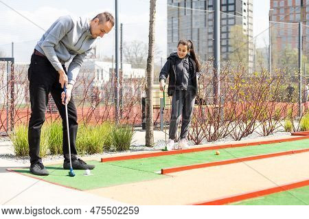 Mini-golf Ball On Artificial Grass. Summer Season Game