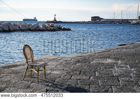 Vesuvius Seen And Fish Boats From The Seafront Of Naples In Italy
