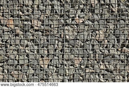 Gabion, Texture, Background. Fragment Of Gabion Net, Wall Design. New Technologies In The Manufactur