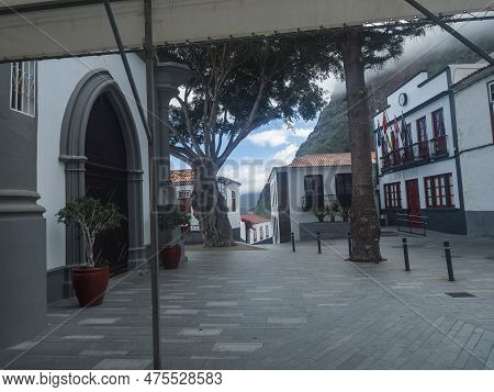 Square With Town Hall And Church Iglesia De San Marcos Evangelista In Traditional Style. Village Of 