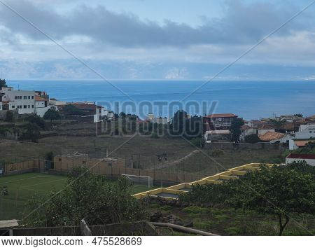 View Of Old Village Agulo With Colorful Traditional Houses, Terraced Fields, Green Field And Mountai
