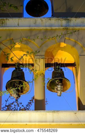 Greek Orthodox Church Bells Illuminated At Night In A Church In Preveza In Greece