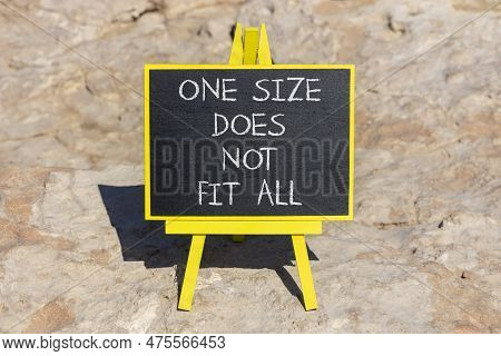 One Size Does Not Fit All Symbol. Concept Words One Size Does Not Fit All On Black Chalk Blackboard 