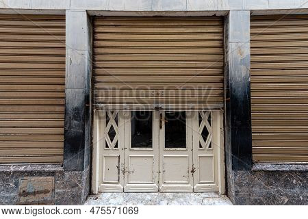 Half Closed Shop Doors In Arabic Country. Tunisia. Shop Is In Downtown And Closed Because Of Early M