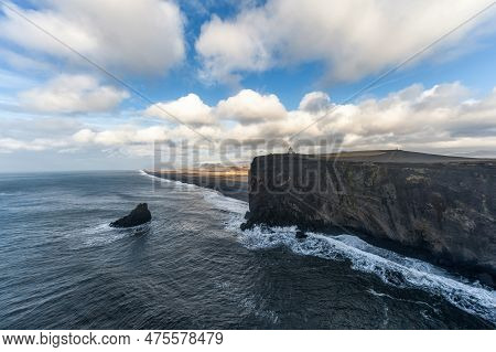 Dyrholaey Area In Iceland. Close To Black Sand Beach. Sunrise. Lighthouse In Background