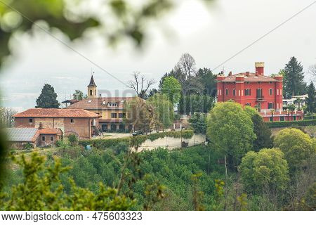 Panoramic View Of The Hills With Green Vegetation And A Red Castle Or Building From San Sebastiano D