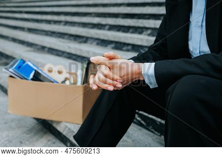 Human Hands Clutching A Carton Box, Representing Job Loss And Financial Hardship. Human Touch The Lo