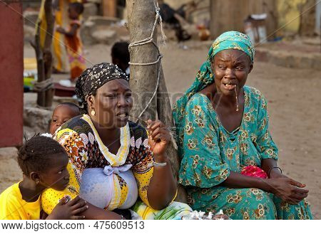 Saint-louis. Senegal. October 10, 2021. Women In National Clothes With Young Children In The Mercile