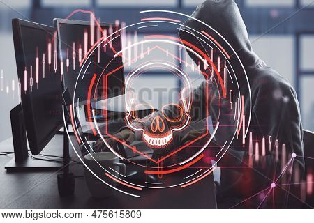 Side View Of Hacker Using Laptop With Abstract Glowing Skull Hologram On Blurry Office Interior Back