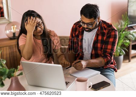 Serious Wife And Husband Planning Budget, Checking Finances, Focused Young Woman Using Online Calcul