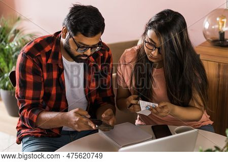 Serious Wife And Husband Planning Budget, Checking Finances, Focused Young Woman Using Online Calcul