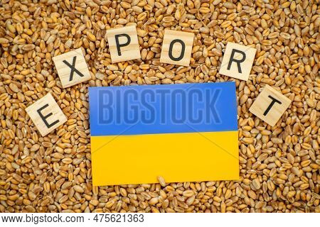 Export Of Ukrainian Grain Concept. The Word Export And The Flag Of Ukraine On A Grain Background.