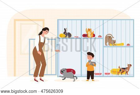 Adopting Pet From Animal Pound. Woman With Her Son Chooses Pet. Cat, Rabbit And Dog In Cages. Rehabi