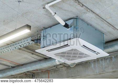 Industrial Air Conditioner In The Office On A Concrete Ceiling.