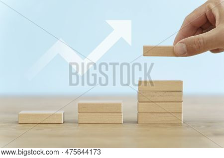 Growth, Target, Upskill Concept. Growth Of Wooden Cubes On A Clean Background. Business, Economics, 