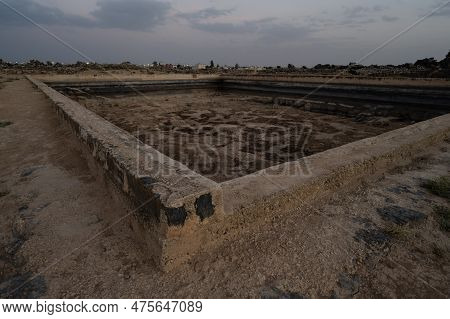 Umm El Jimal Roman Water Reservoir Or Basin In Jordan In The Evening