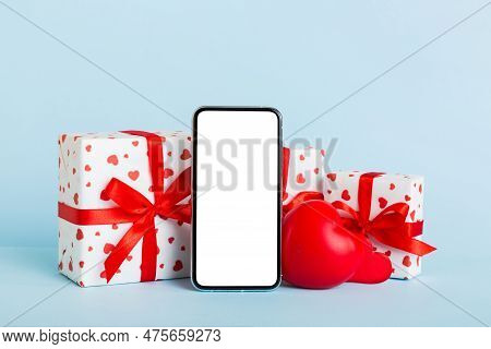 Mobile Phone With Blank Screen On Colored Background With Hearts, Calendar And Gift Box, Valentine D