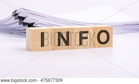 Wooden Blocks With Text Info On White Table, Stack White Paper On Background