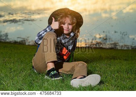 Little Child With Backpack And Binoculars. Imagination Or Exploration In Park. Happy Child Playing W