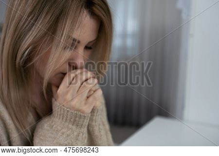 Spirituality And Young People. Girl Praying At Home Alone. Worried Woman Praying For Strenght During