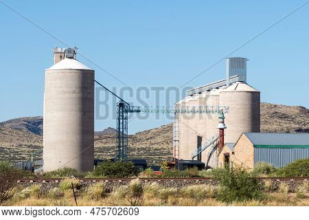 Prieska, South Africa - Mar 1, 2023: Grain Silos In Prieska In The Northern Cape Province. A Railway