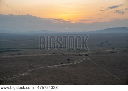 Aerial View Of The Masaai Mara Reserve In Kenya During Sunrise