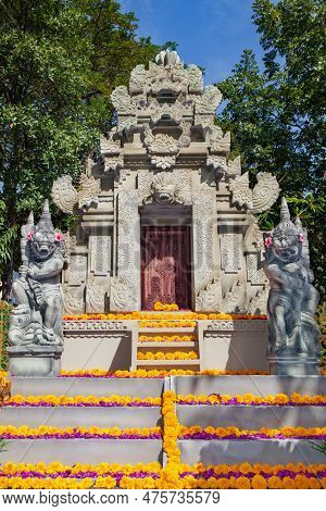 Traditional Balinese Temple With Guard Spirits. Decorated By Flowers For Religious Holidays.