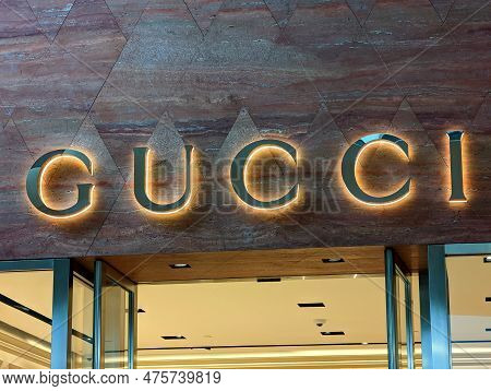 Honolulu, Hawaii - March 28, 2022:  Gucci Store Front With Illuminated Gucci Signage