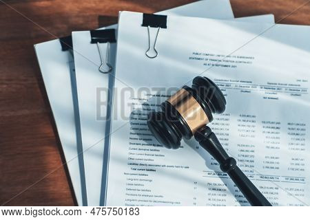 Closeup Top View Black Wooden Gavel Hammer And Legal Document On Wooden Office Desk Background As Ju