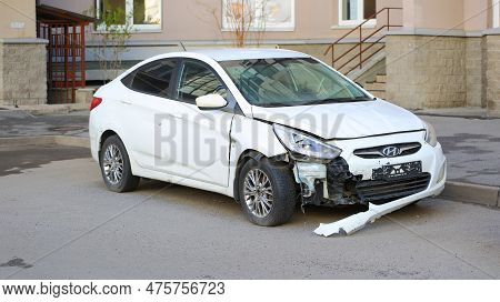 A New White Wrecked Car In The Courtyard Of The House, Soyuzny Prospekt, St. Petersburg, Russia, May