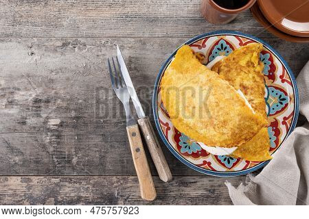 Traditional Venezuelan Beef Cachapa On Wooden Table. Top View. Copy Space