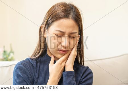 Closing Eyes Asian Young Woman Touching Cheek, Face Expression From Toothache, Tooth Decay Or Sensit