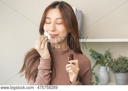 Aromatherapy, Cute Asian Young Woman Holding Cotton Pad, Bottle Of Essential Perfume Oil, Enjoying S