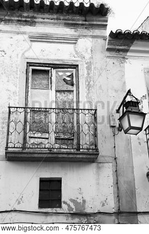 Old Houses With White Chipped Facades In Evora Town, Portugal